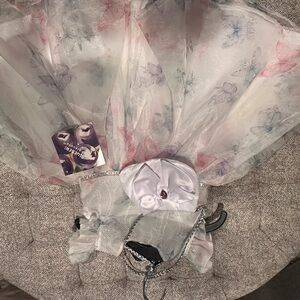 Valia White Dress with Pastel Floral Accents and Jewel Bow